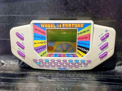 Tiger Wheel of Fortune Handheld Electronic Game 1995 Works Battery-Powered Puzzle Solver