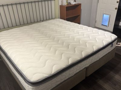 King size bed + mattress (mattress was bought new 6 months). Headboard, rails, & box springs included. Very comfortable!