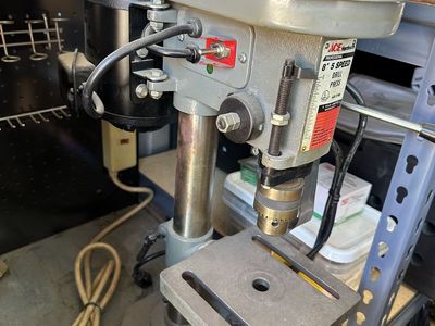 Drill press with metal cabinet-workbench