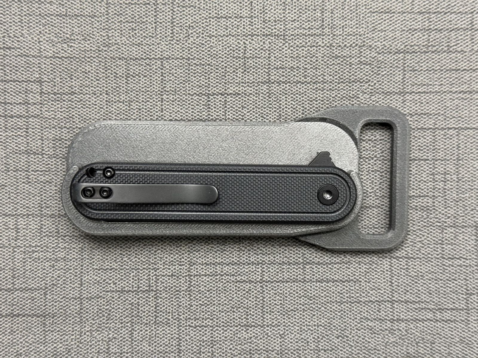 Knife with  belt buckle holder