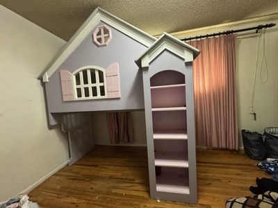 Unique Playhouse Loft Bed with Built-in Bookshelves - Perfect for Kids' Rooms