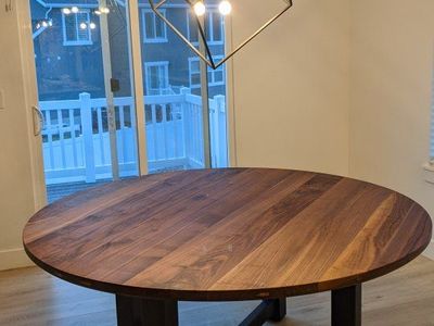 Solid walnut dining table with metal legs