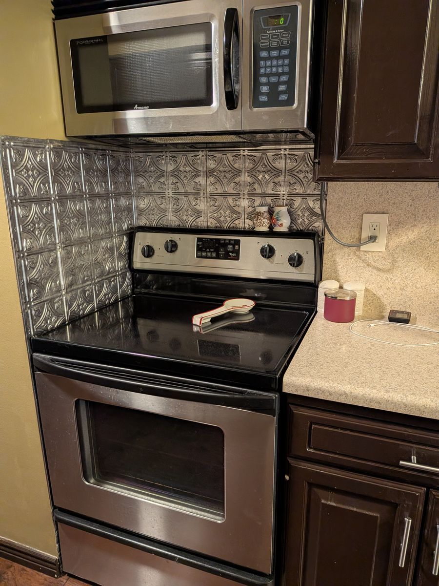 Whirlpool Stainless Steel Electric Range with Smooth Glass Cooktop And Matching over the Stove Microwave Oven