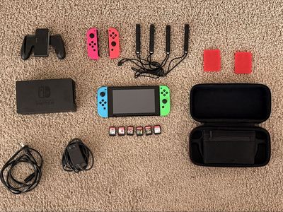 Nintendo Switch + controllers + Games