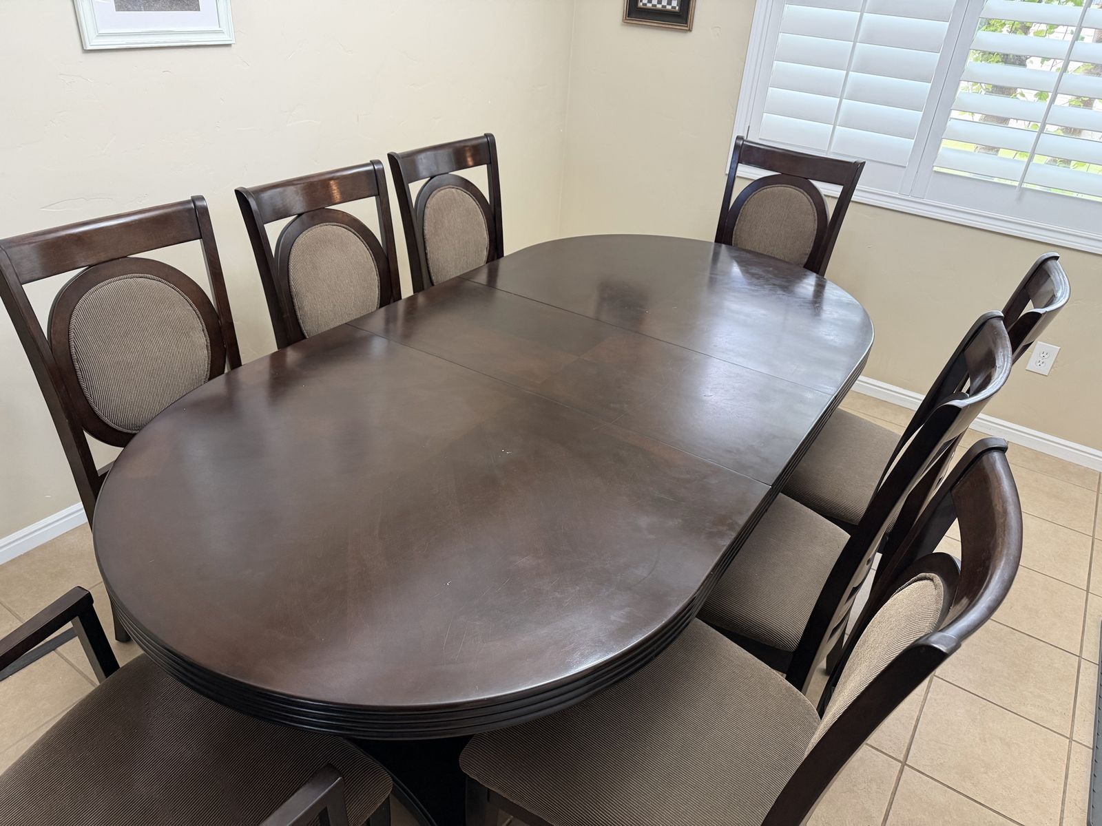 Dark Wood Oval Dining Table with 8 Upholstered Chairs - Extendable Leaf Included