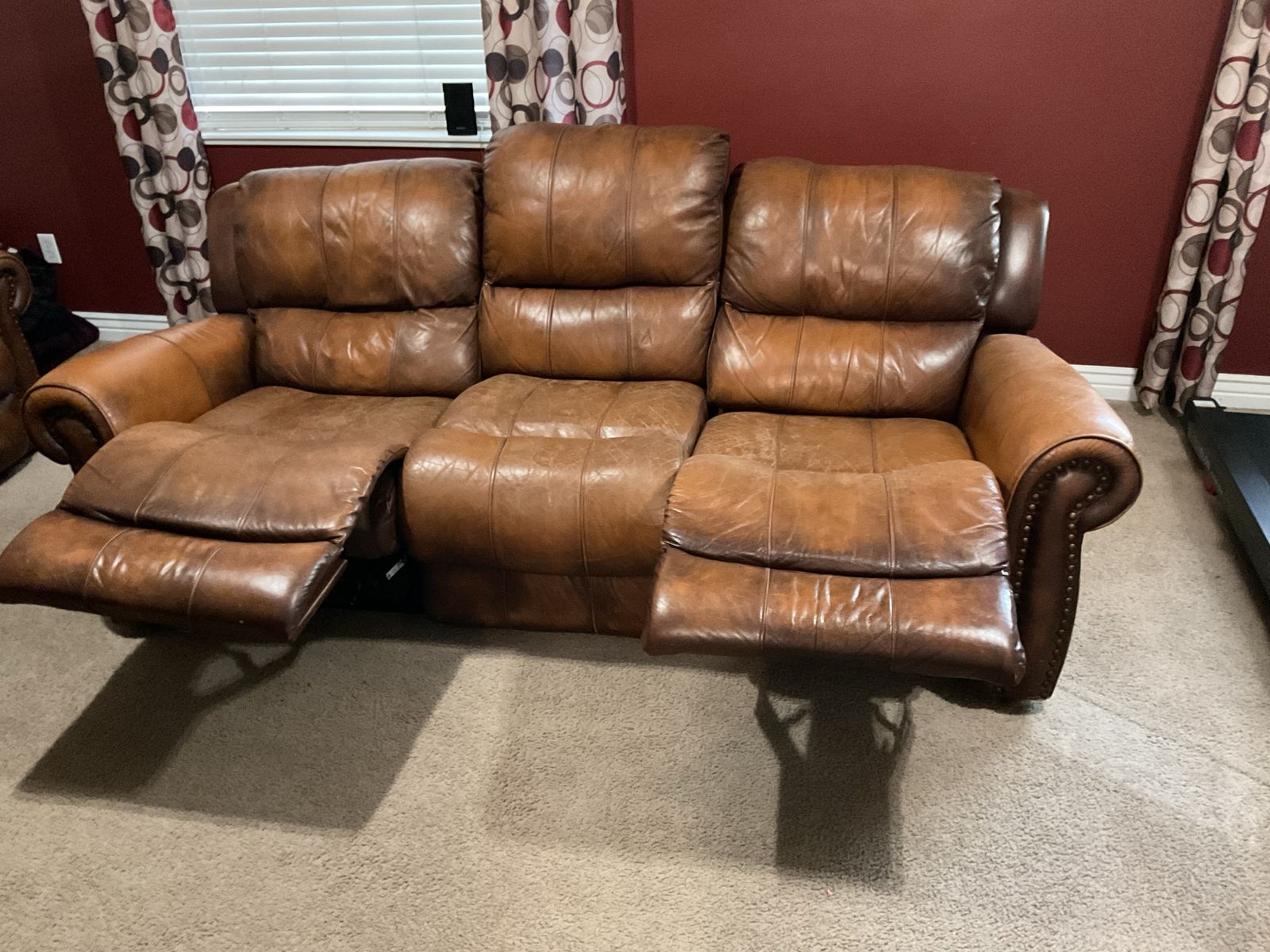 Manual reclining brown leather sofa and loveseat
