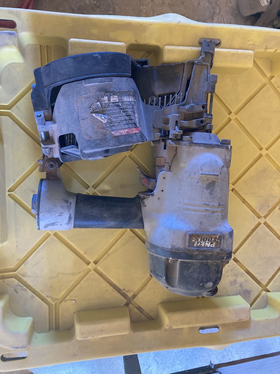 2 1/2 inch coil nail gun and boxes of coil nails