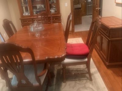 Dining Table with upholstered chairs, China cabinet and surfing table. Includes two extra leaves.