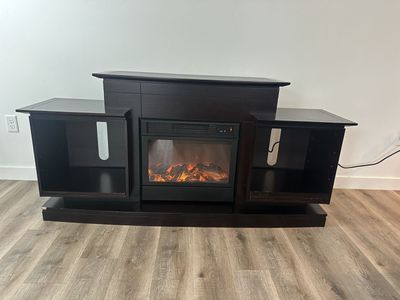 Entertainment center with built in fireplace
