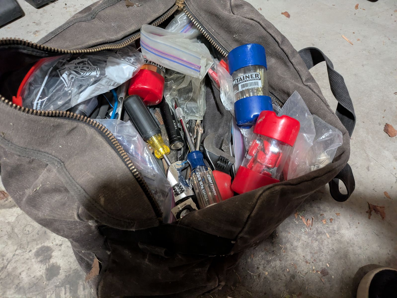 Tool bag full of miscellaneous tools
