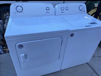 Side by side top load washer and electric dryer set