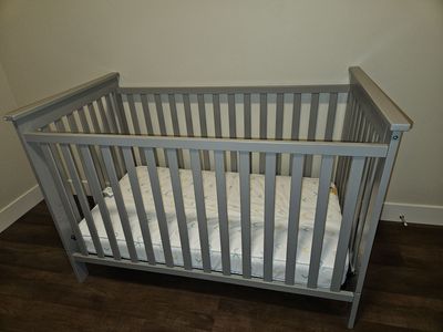 Grey crib and matress