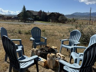 6 Adirondack Chairs, Fire Pit and Bundled Firewood