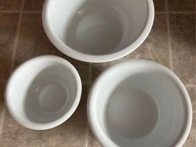 Good for college students or if you’re getting your first place Set of 3 White Ceramic Mixing Bowls & Stainless Steel Colander