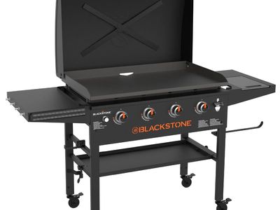 Nearly new Blackstone 4-Burner Outdoor Gas Griddle with Hard Cover and Side Shelves
