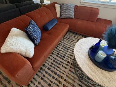 Comfy orange sofa priced to sell