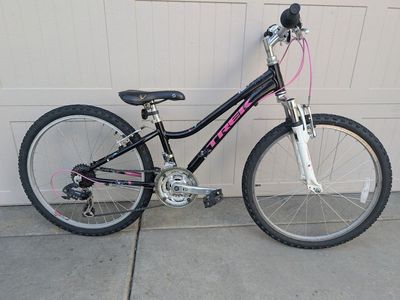 Trek MT220. 24" wheels, 21 speeds, shocks.