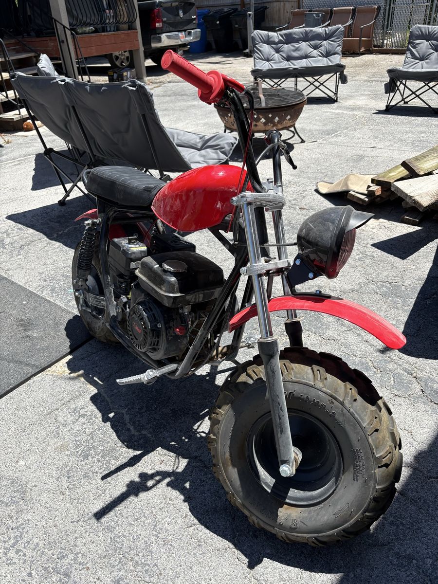 Red Mini Bike with Black Seat and Off-Road Tires