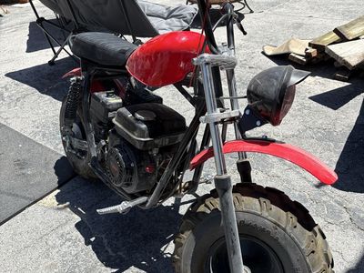 Red Mini Bike with Black Seat and Off-Road Tires