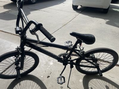 Boys 20 Inch matte black BMX-style freestyle bike