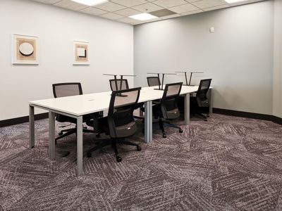 "Your Desk Awaits: A Space for Focused Collaboration!"