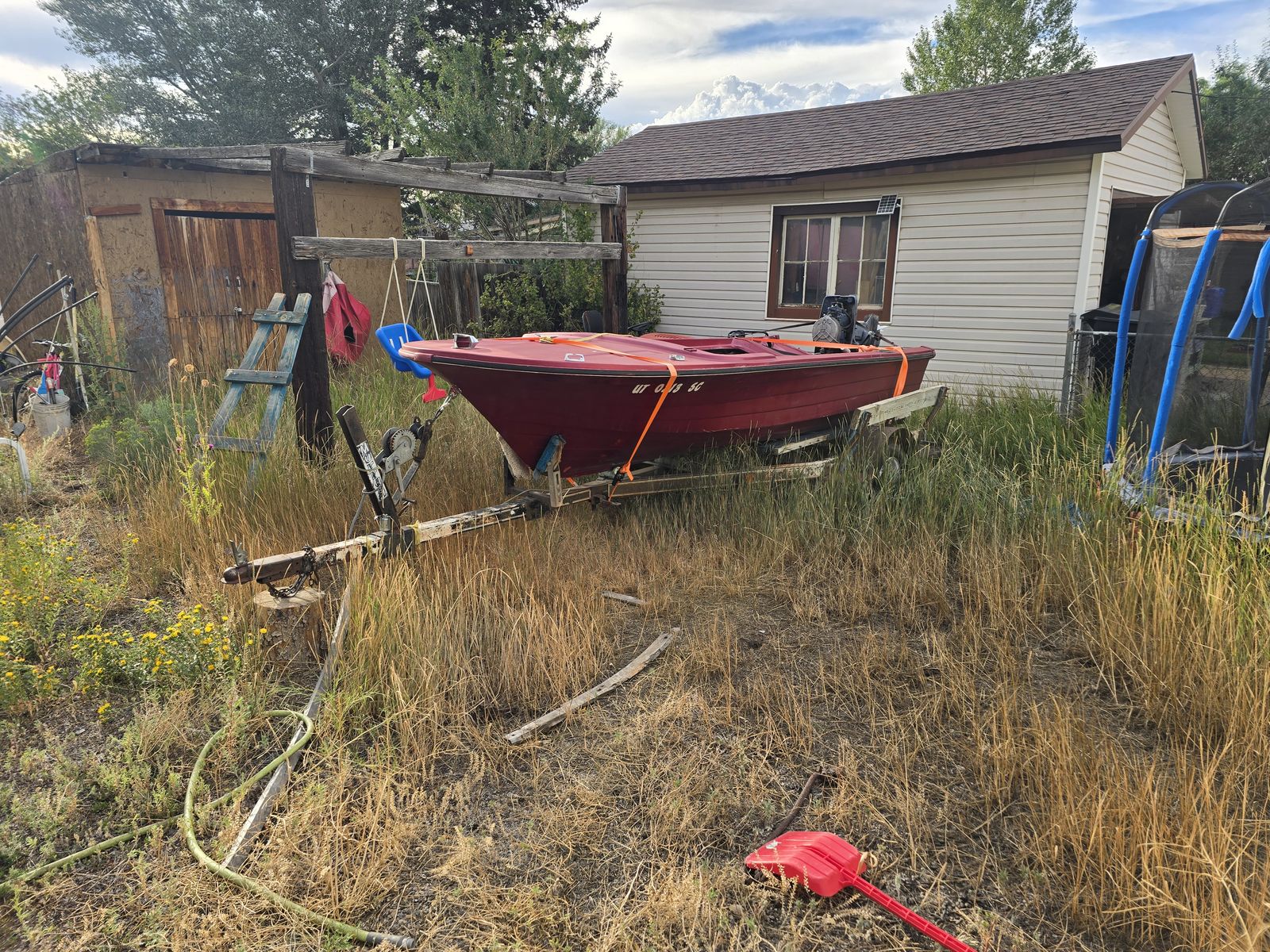 Red Jon Boat with Trailer, Outboard Motors, and Trolling Motor