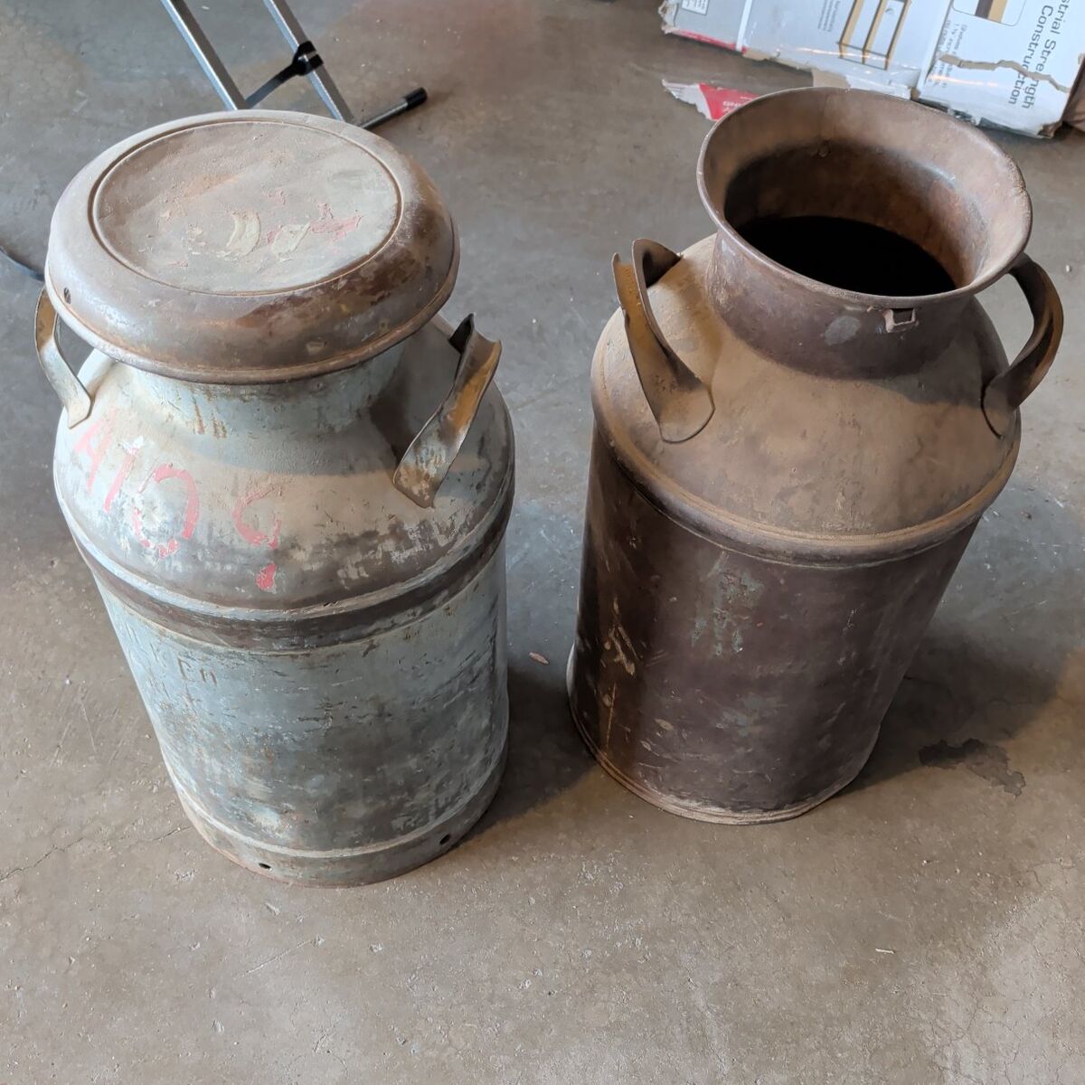 Vintage metal milk jugs