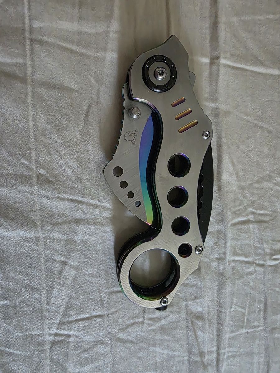 Falcon claw pocket knife
