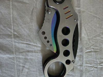 Falcon claw pocket knife