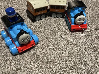 Vintage Thomas the Tank Engine with Annie and Clarabelle pull toy 1997. Vintage Thomas the Tank Engine 2004 push and go train.