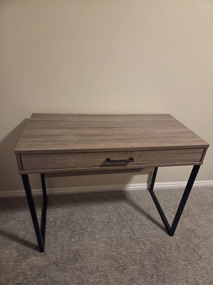 Gray fiberboard desk with storage drawer