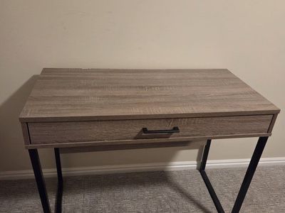 Gray fiberboard desk with storage drawer