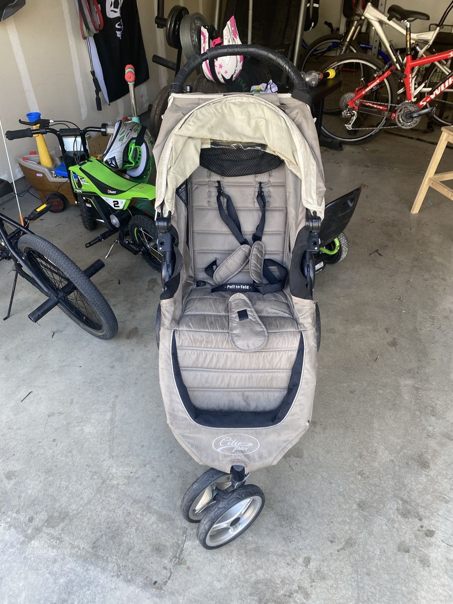 Stroller with stand up attachment