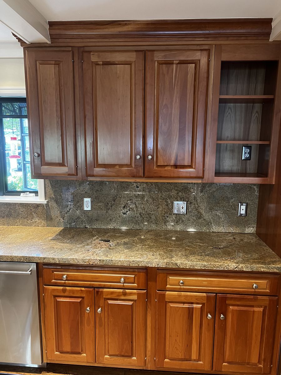 Kitchen cherry cabinets and stainless appliances (double ovens, cooktop, dishwasher, 2 stainless sinks, faucets and disposal