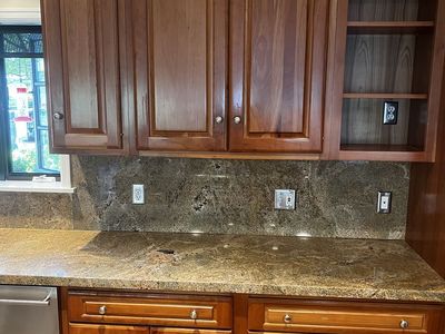 Kitchen cherry cabinets and stainless appliances (double ovens, cooktop, dishwasher, 2 stainless sinks, faucets and disposal