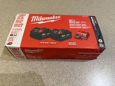 Brand new Milwaukee M18 Two 5AH batteries and charger