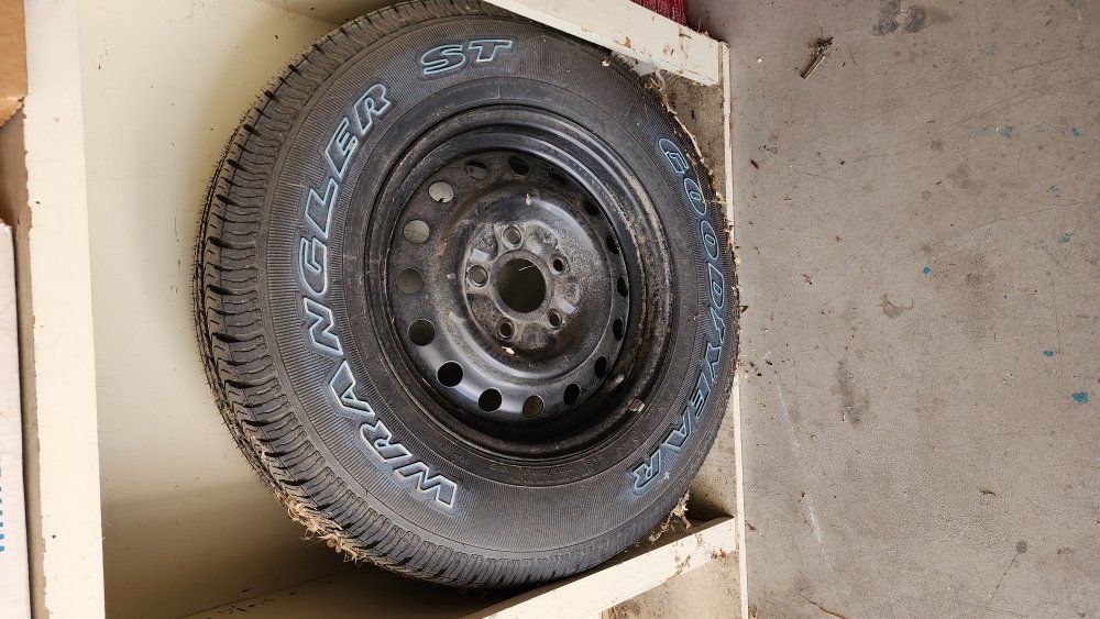 Goodyear Wrangler ST P225/75R16 Tire & Rim
