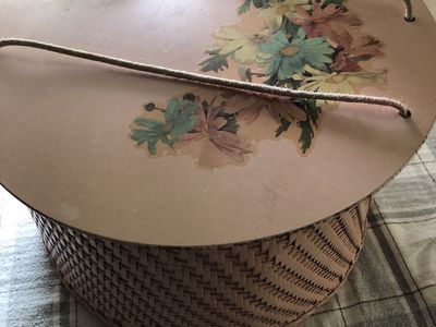 Vintage Woman's wicker hat holder.