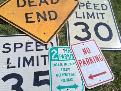 Signs retired road speed limit parking