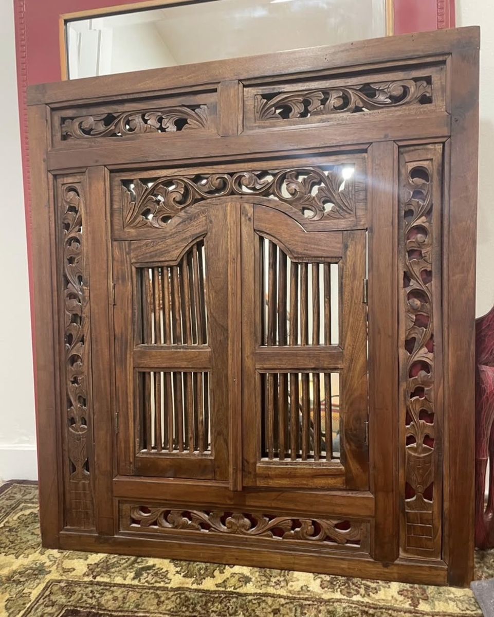 Carved wooden window mirror