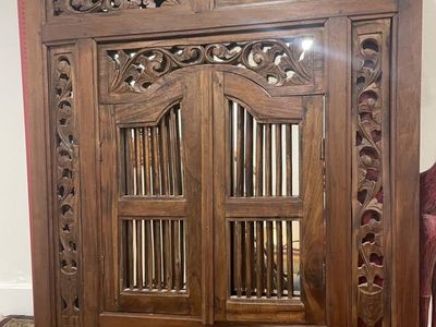 Carved wooden window mirror