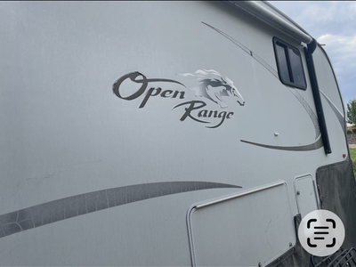 Open Range 385 RSL 4-slide 5th wheel camper trailer.