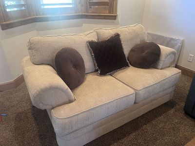 Living Room Furniture Set: Beige Sofa, Pair of Patterned Accent Chairs, and Wood Console Table