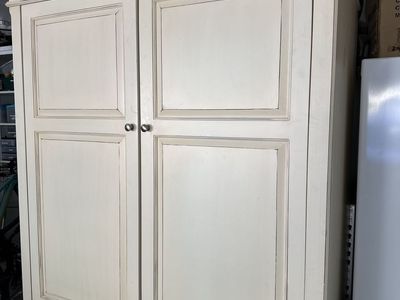 Crème colored Armoire with shelves