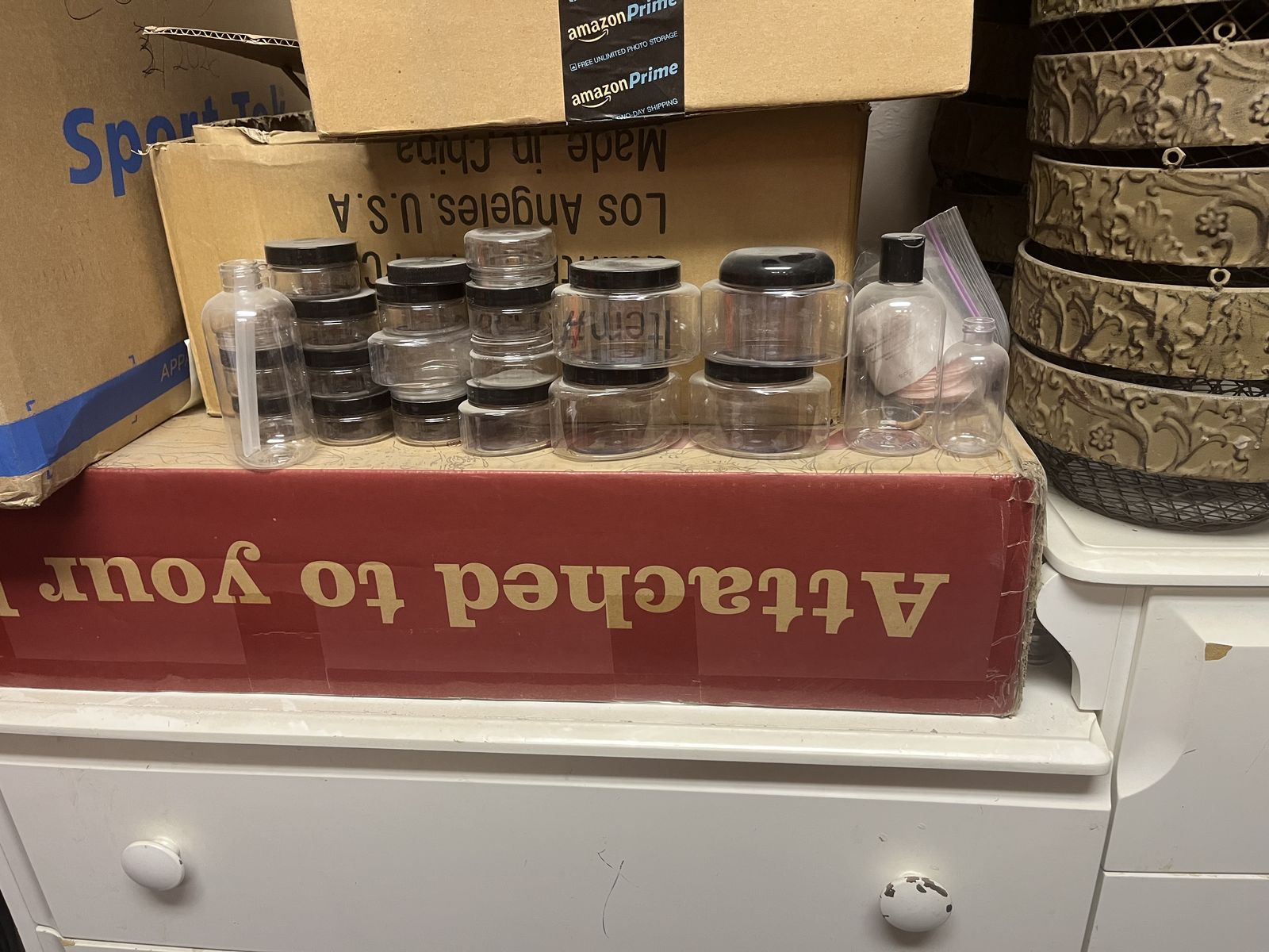 Assortment of new bottles, containers, and metal baskets.