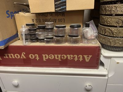 Assortment of new bottles, containers, and metal baskets.