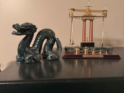 Dragon and scale with weights