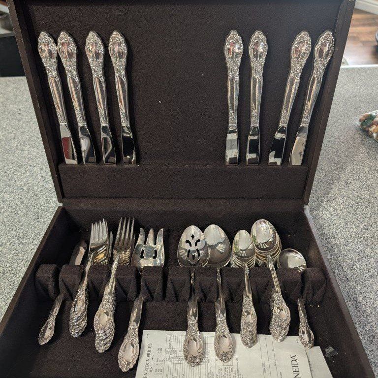 2 Oneida silverware sets