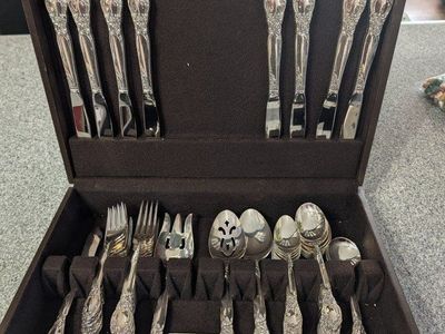 2 Oneida silverware sets