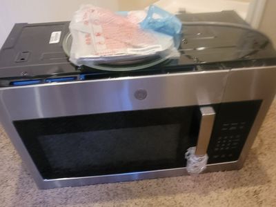 Brand New GE®1.6 Cu. Ft. Over-the-Range Microwave Oven with Recirculating Venting
